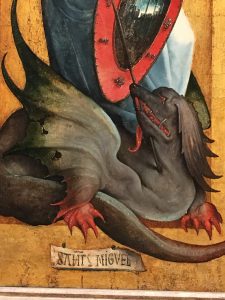 A Dragon detail from a painting by Juan de Flandes, where Saint Michael's sword pierces the dragon.