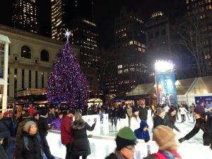 Ice skating in Bryant Park behind the New York Public Library, 5th Avenue branch.